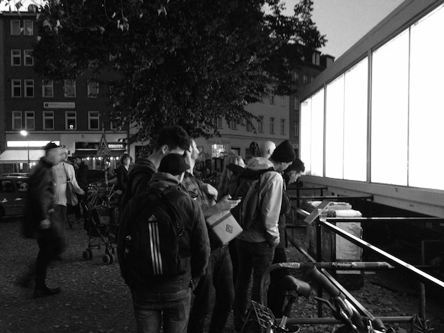 Onlookers outside the Verhoeven glass fronted installation, Berlin, Oct. 2014 
